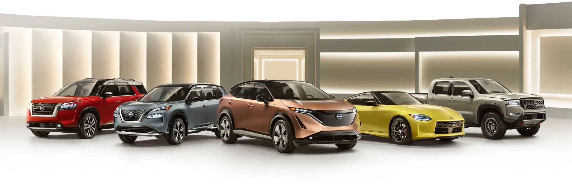 Nissan vehicle lineup featuring a sedan, a truck, and multiple SUVs