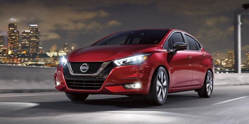 Nissan of Lexington Park in California MD Nissan Versa fron view in red with headlights on