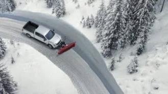 Nissan of Lexington Park in California MD birds eye view of a white pickup truck plowing snow