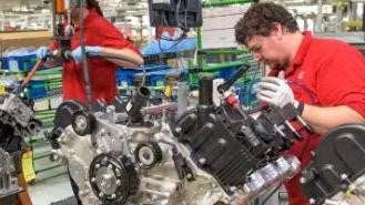 Nissan of Lexington Park in California MD worker assembling a Nissan engine