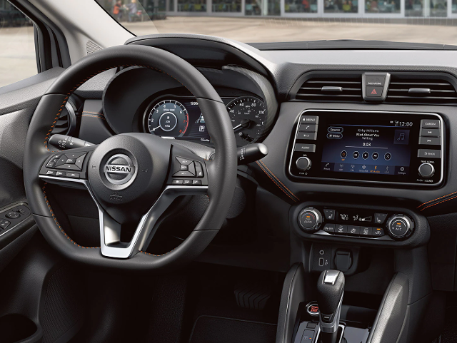Nissan of Lexington Park in California MD close up of Versa stick shift, steering wheel and dash
