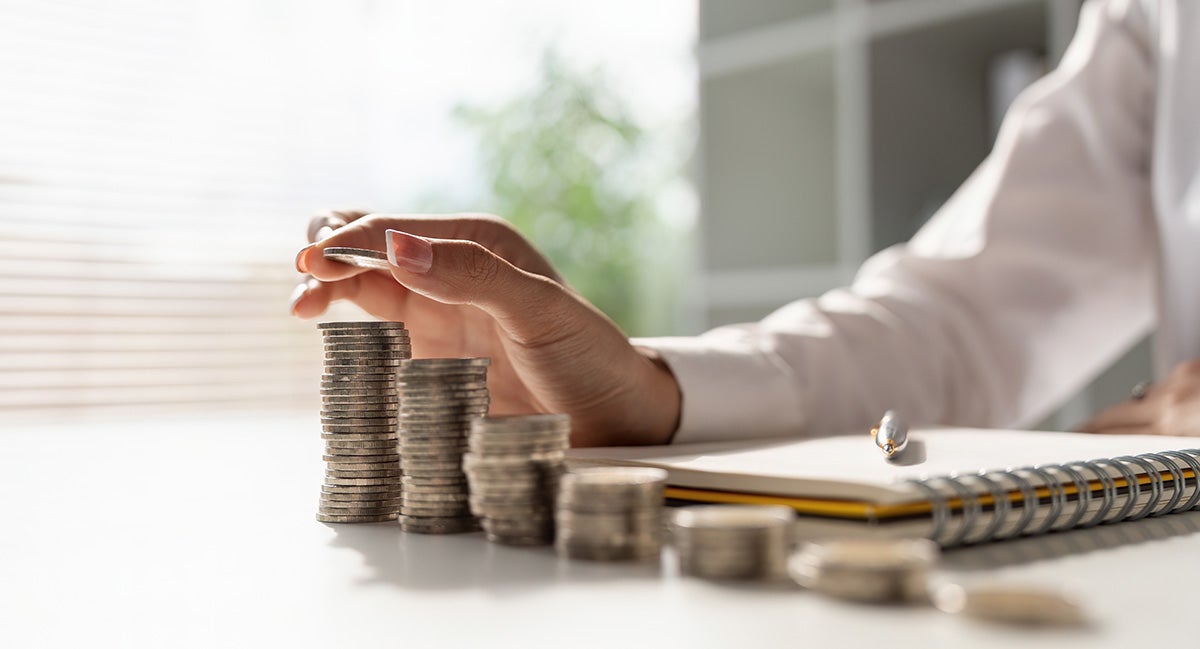 Man arranging coins on a table